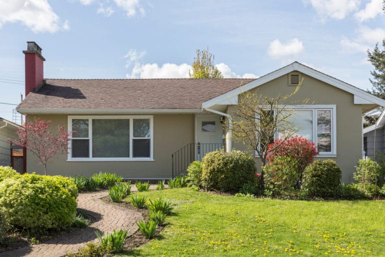 Ranch house with green lawn